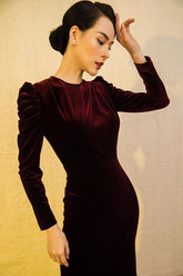 Velvet midi dress with ruched sleeves and fitted silhouette for elegant evening styling